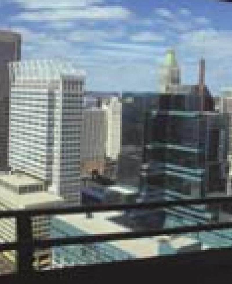 Man looking out window from observation level Photo