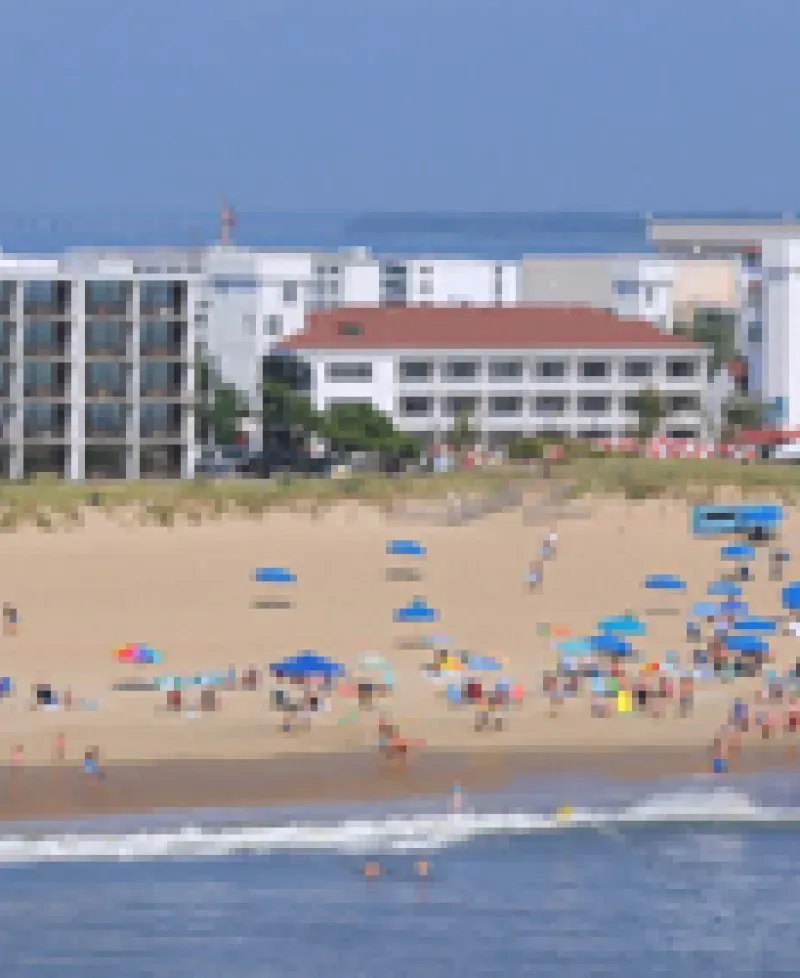 Beach view of the Castle In The Sand Hotel Photo