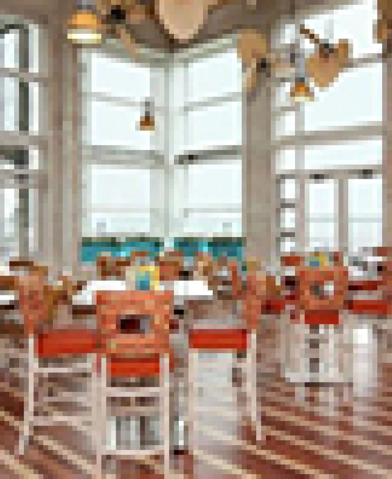 Interior of Blue Point Provision with large glass windows. Photo