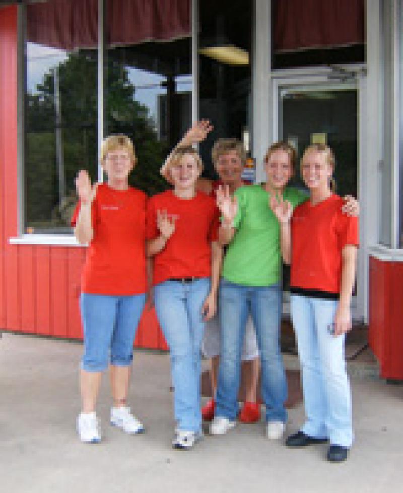 Group waves outside Cindy's East Side Kitchen. Photo
