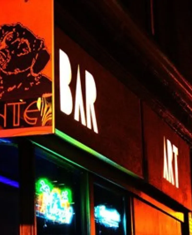 Dant's Bar, Art, Music sign lights up the night. Photo
