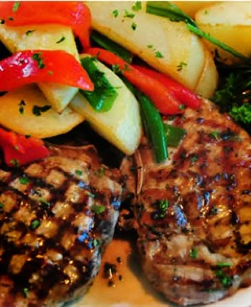 Grilled Pork Chops, mixed vegetables and broccoli Photo