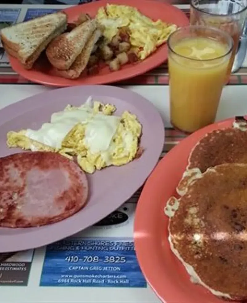 Pancakes, eggs, ham and juice Photo
