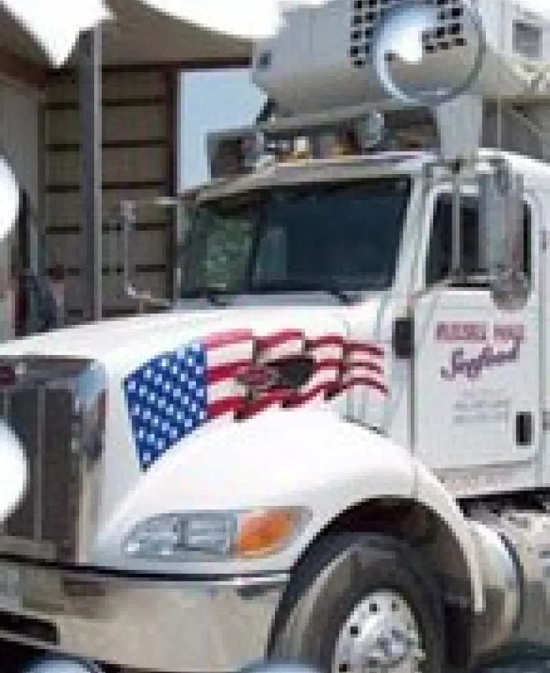 A refrigerated truck gets ready to deliver fresh seafood. Photo