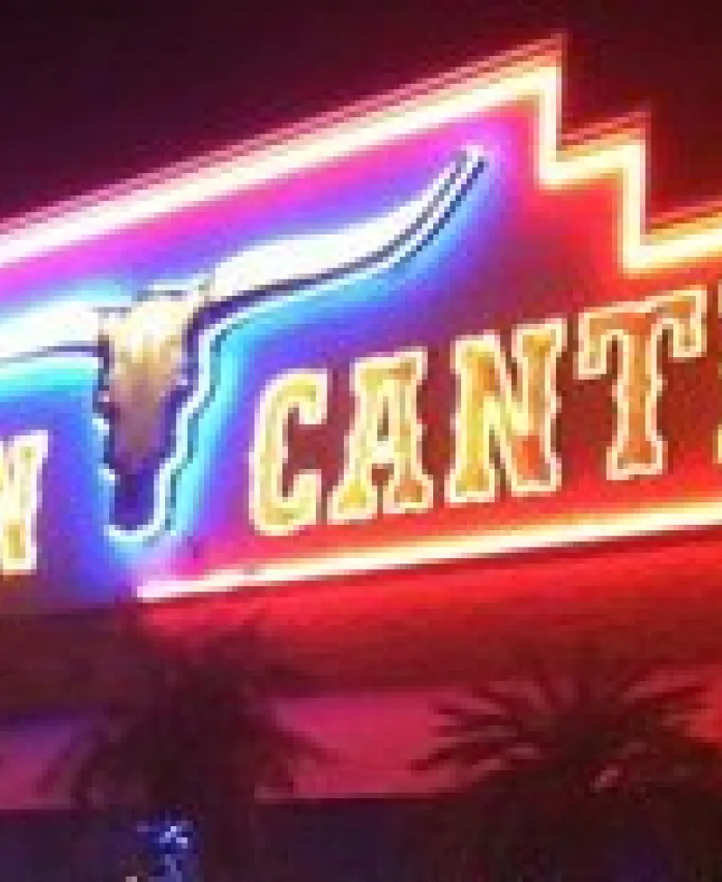Cancun Cantina sign glows at night. Photo