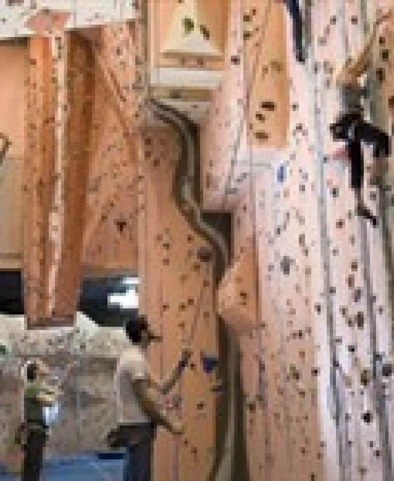 Climbers climbing interior Earth Treks' walls Photo