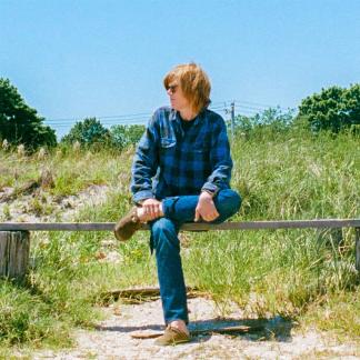 man sitting on a bench Photo