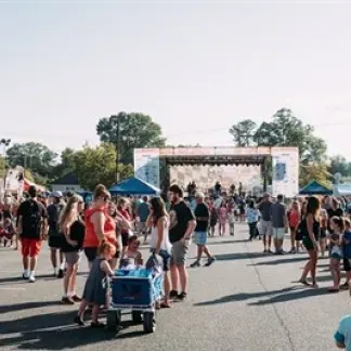 People at an outdoor festival Photo