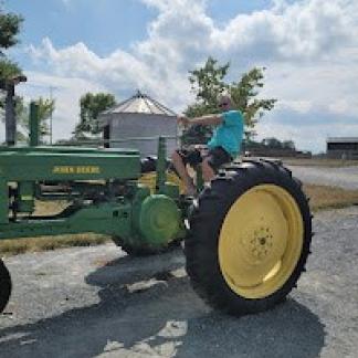 Dad on tractor Photo