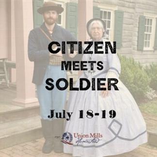 A Civil War soldier stands arm in arm with a woman in period dress in front of a historic house. Photo