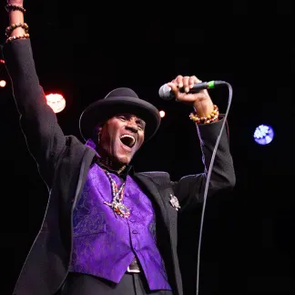 Man Singing Into Microphone Photo
