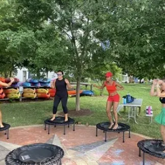 people standing on trampolines Photo