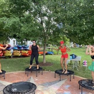 people standing on trampolines Photo