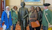 Watermark tour guides with group at the Maryland State House. Photo