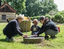 Three people engage in an outdoor activity Photo