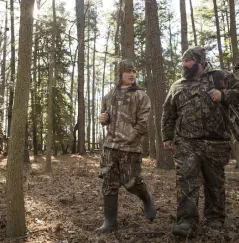 Father and Son in woods hunting