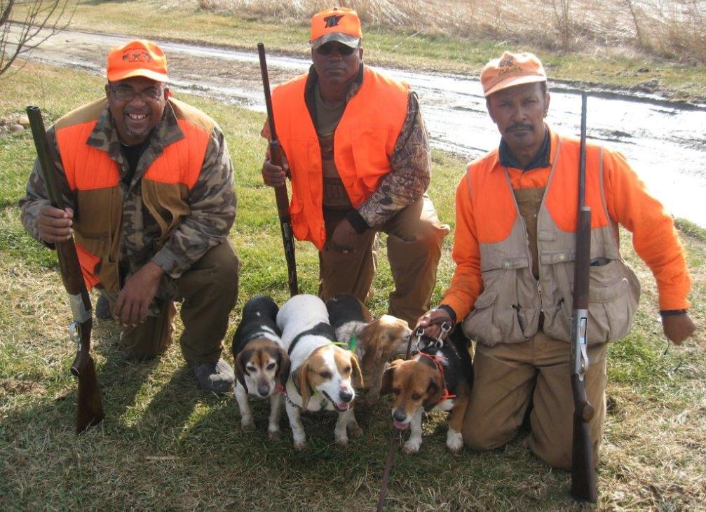 3 hunters and their beagles