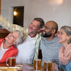 Traveling friends gathered taking a selfie Photo